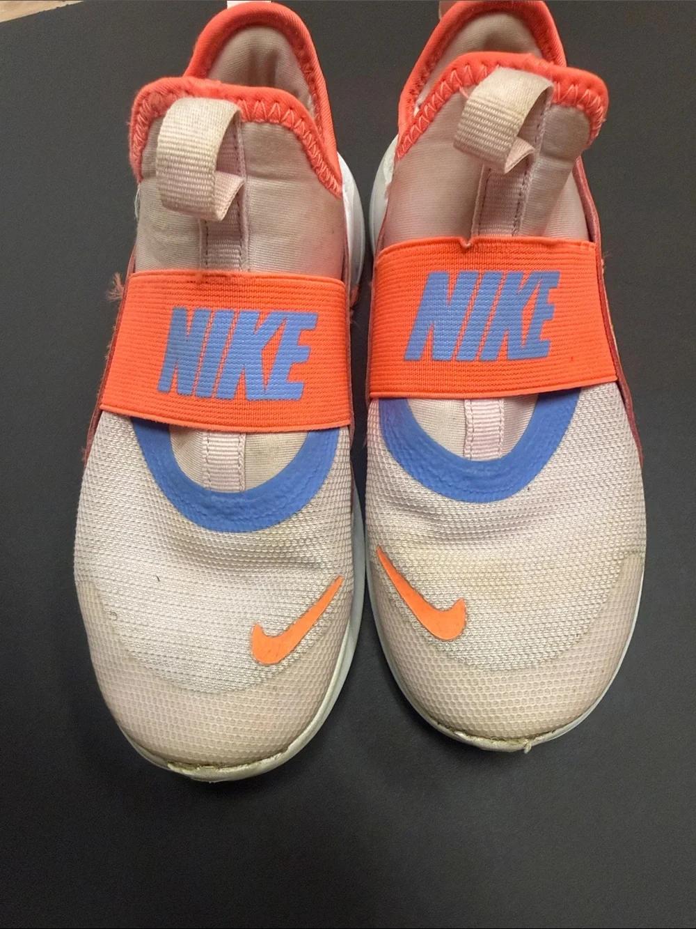Nike Kids Slip-On Sneakers in Coral Pink with Orange and Blue Accents